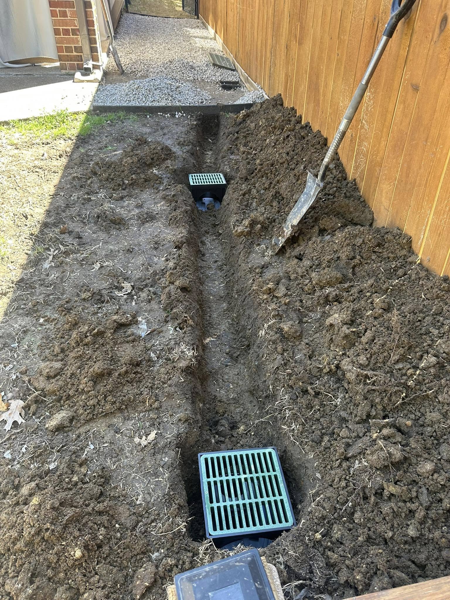 Multiple catch basins along drainage trench