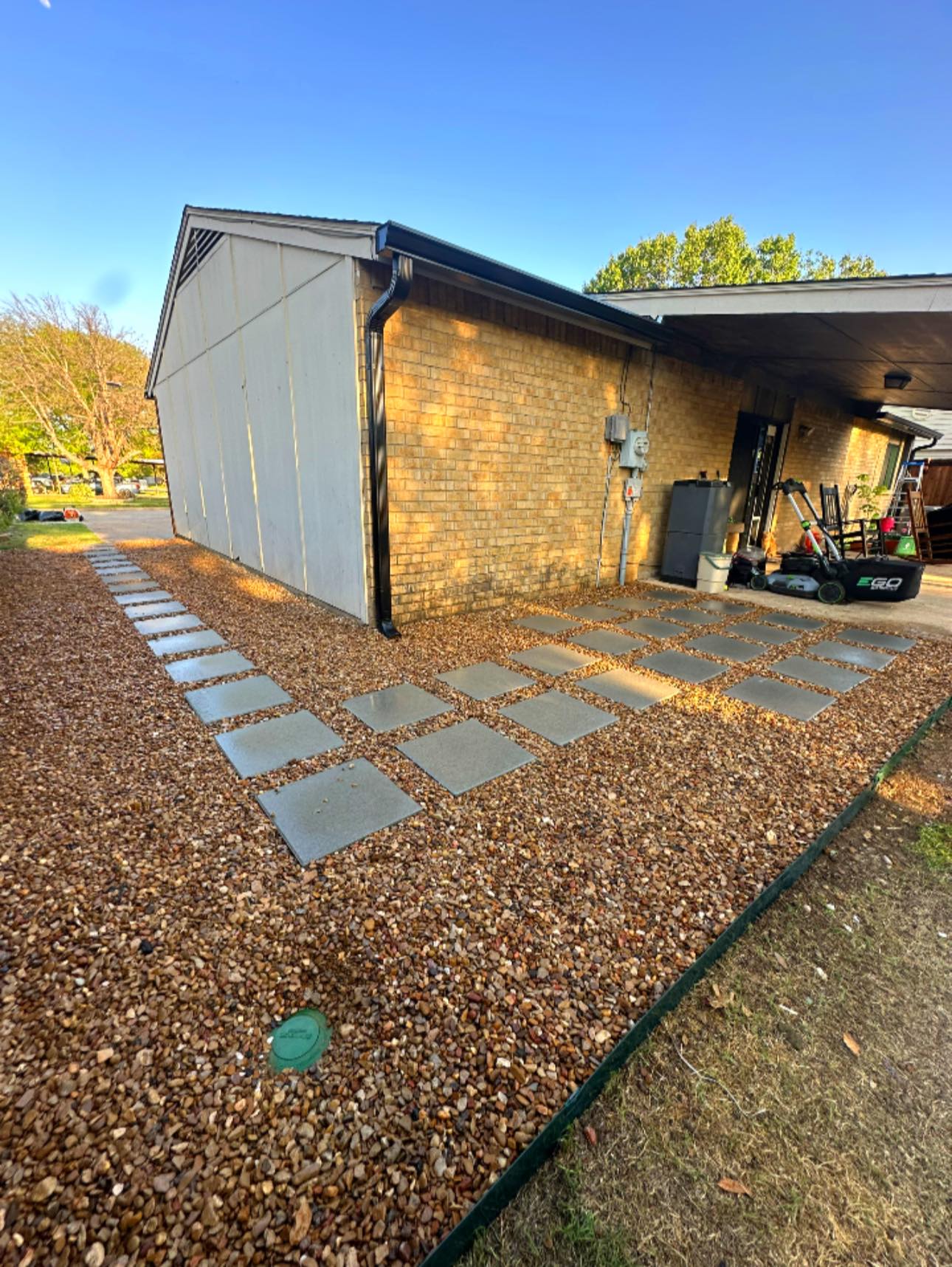 Paver stepping stones with decorative gravel pathway