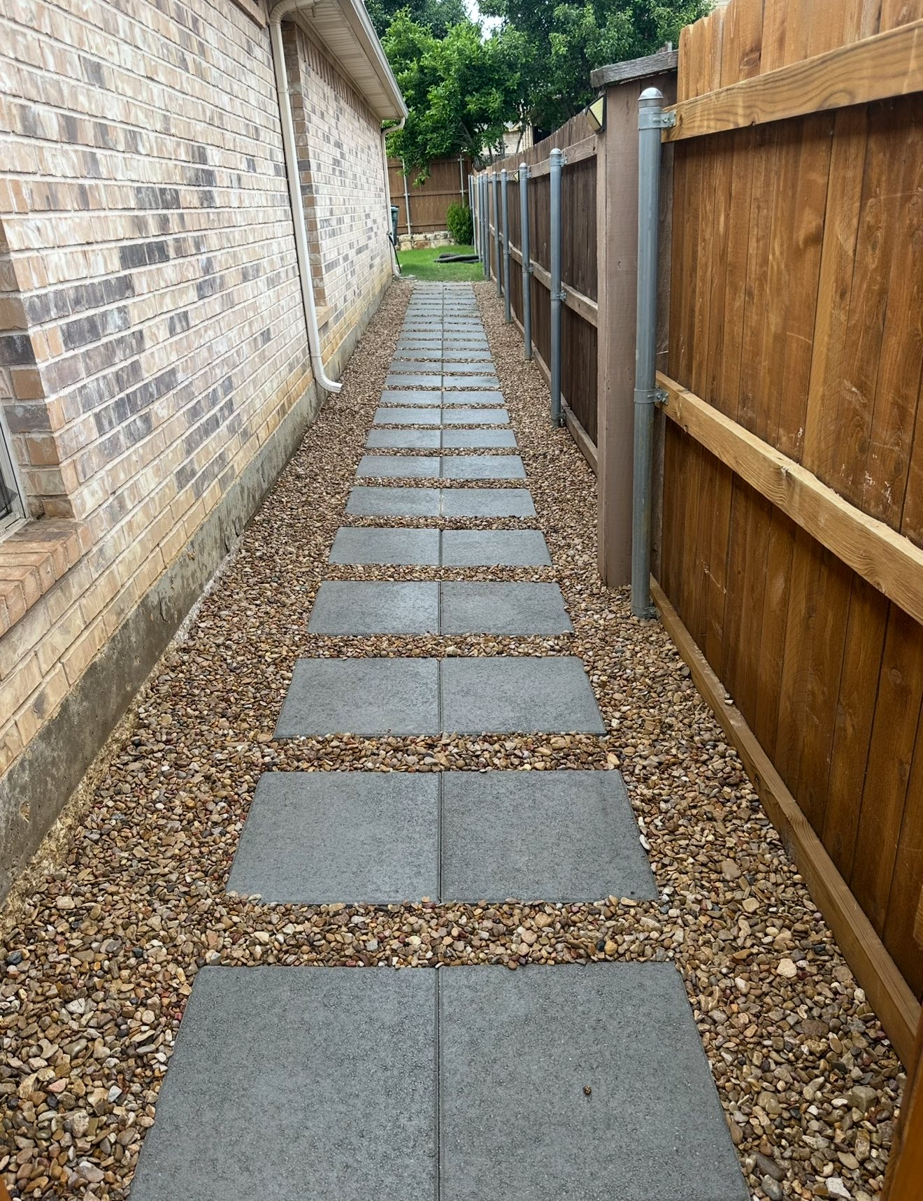 Side yard paver walkway with gravel
